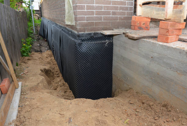 Happy homeowners after waterproofing job in Chuckey